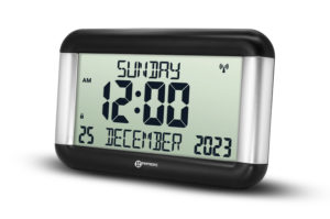 Self-setting day clock with date fully spelled out